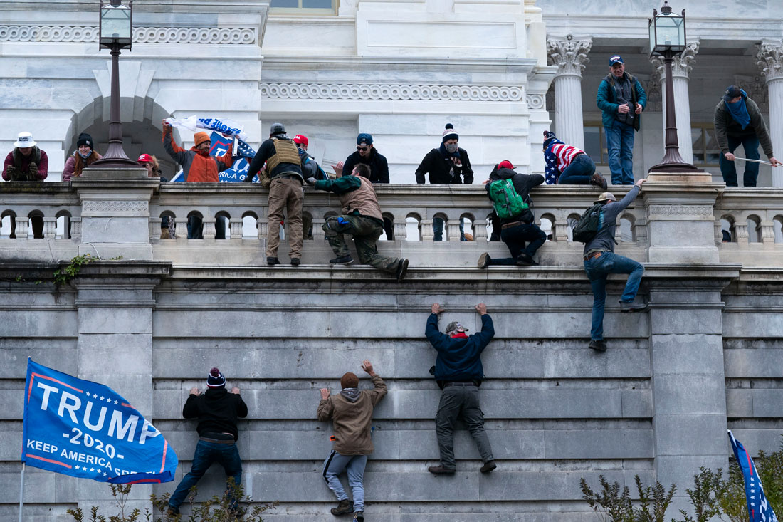 Trump supporters climb the west wall